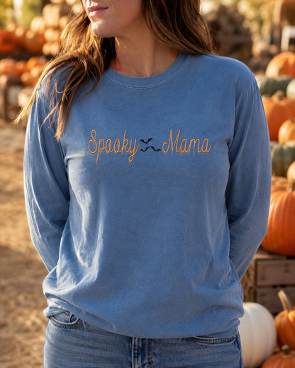 Woman wearing Blue Jean Comfort Colors long sleeve Spooky Mama embroidered shirt at pumpkin patch