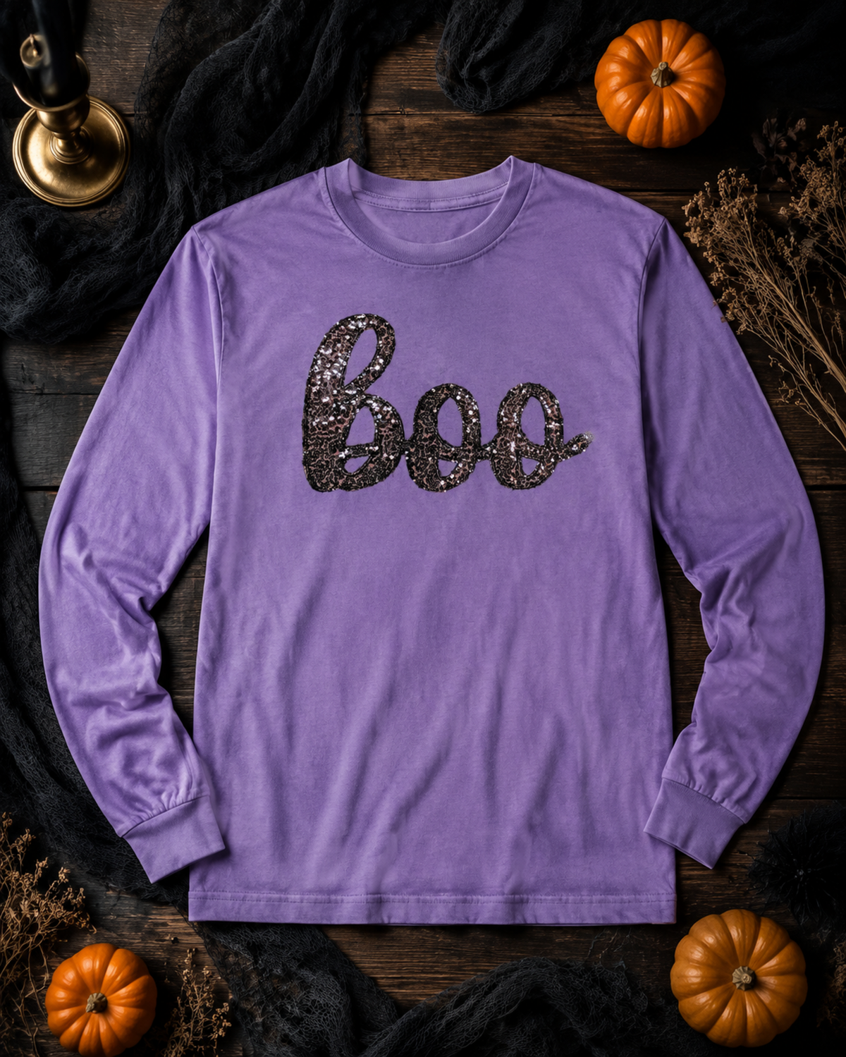 Black sequin Boo appliqué on a Violet Comfort Colors 6014 long sleeve shirt in a Halloween flat lay
