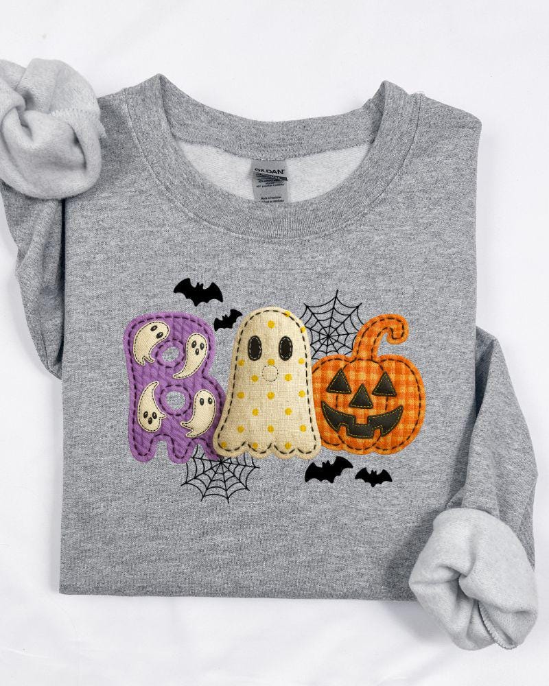 BOO Halloween graphic shown on an adult crewneck sweatshirt