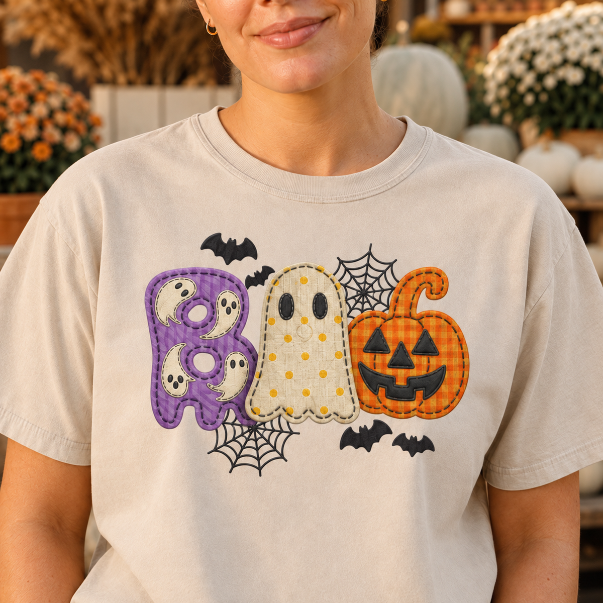 Close-up of DTG printed BOO Halloween design and center chest placement on Sandstone shirt