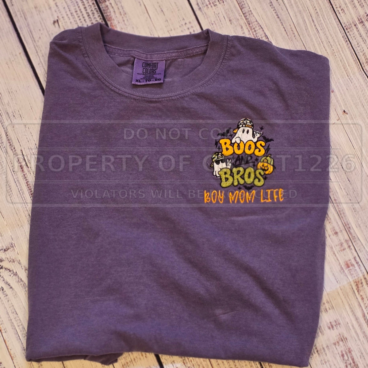 Actual Boos and Bros boy mom Halloween embroidery on a Grape Comfort Colors short sleeve shirt