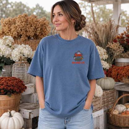 Blue Jean Comfort Colors boy mom ghost embroidery shirt in a bright outdoor fall setting
