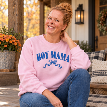 Samantha wearing a Light Pink Gildan Softstyle Boy Mama sweatshirt with royal blue embroidery