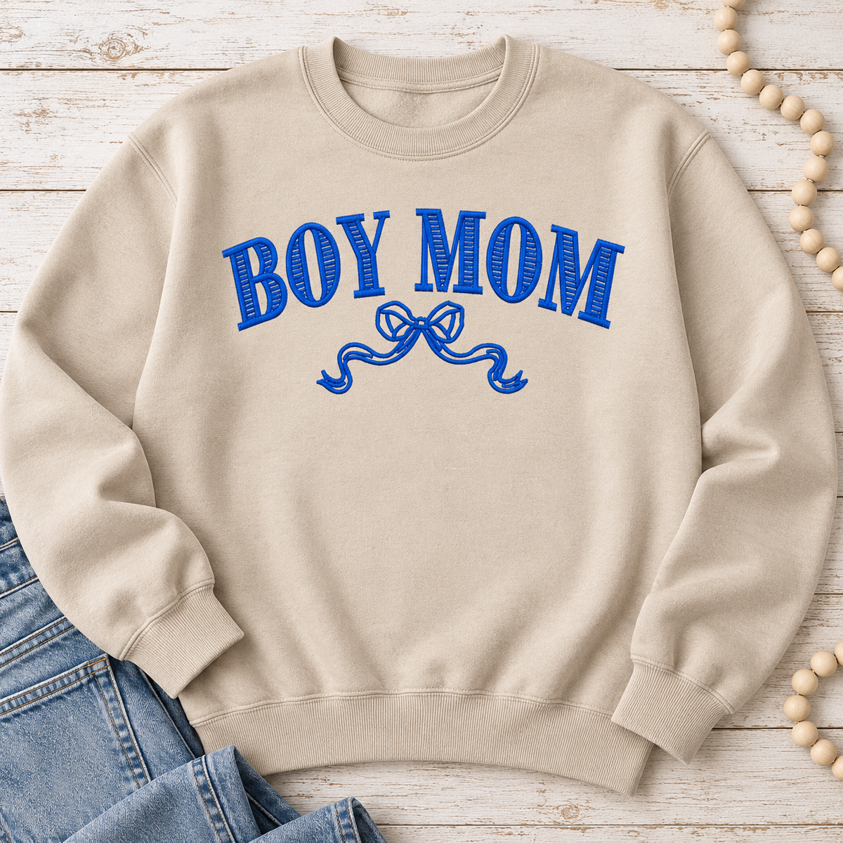 Sand Boy Mom embroidered crewneck sweatshirt with royal blue collegiate lettering and bow