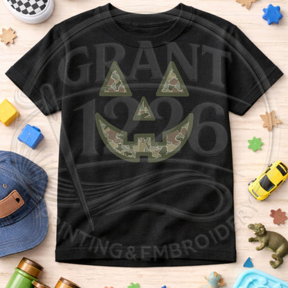 Black toddler camouflage jack-o-lantern Halloween shirt flat lay