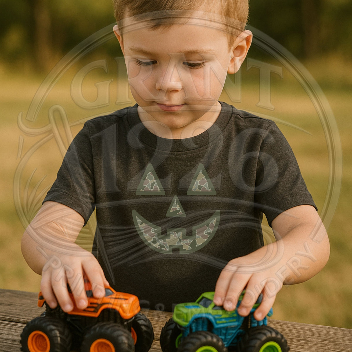 Toddler wearing Black camouflage pumpkin Halloween shirt while playing