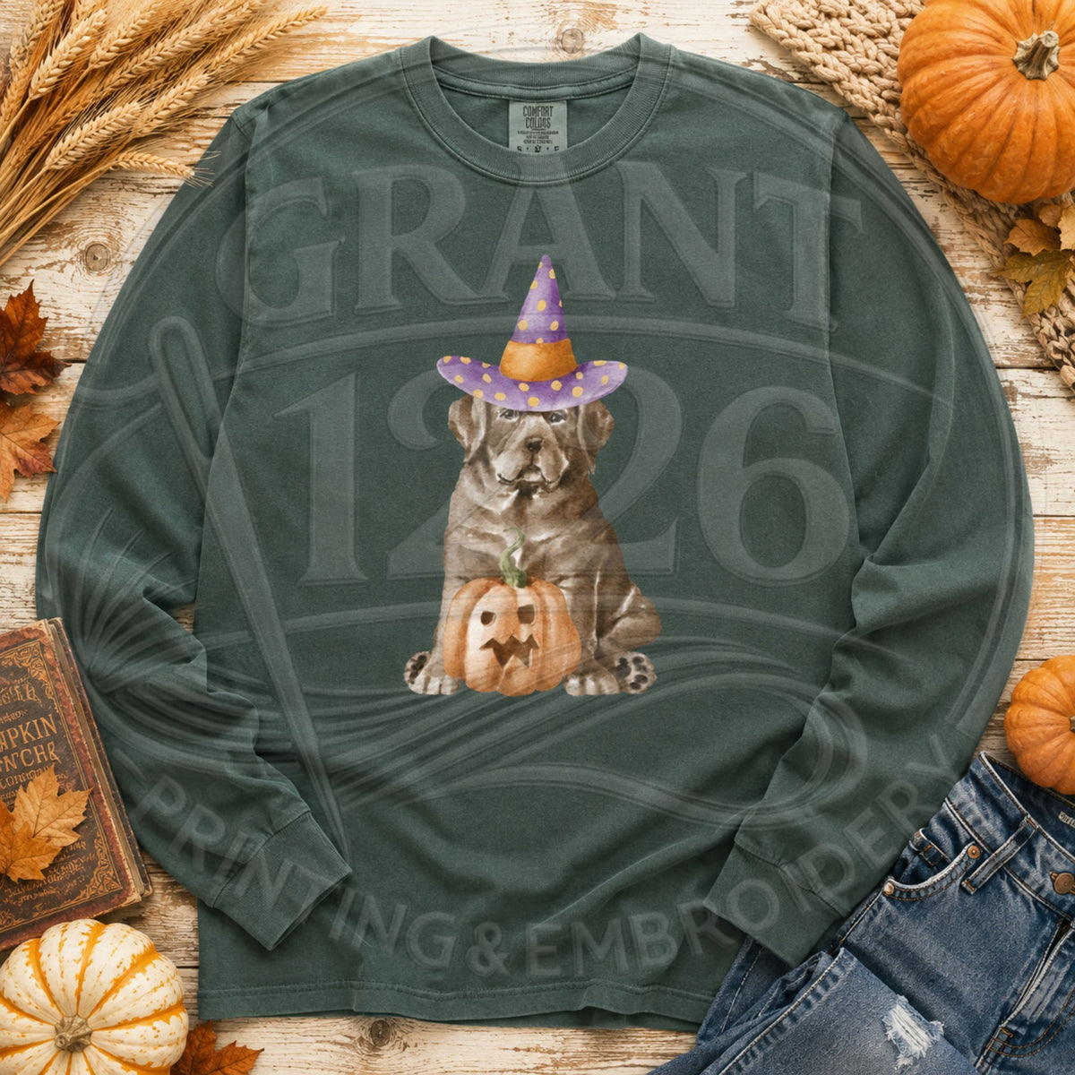 Comfort Colors Blue Spruce long-sleeve shirt with brown witch dog and jack-o-lantern graphic
