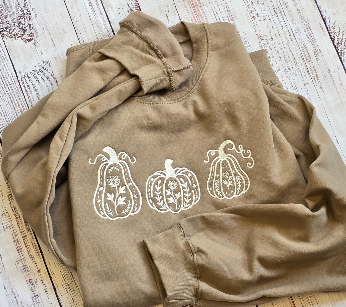 Brown Savana pumpkin trio embroidered sweatshirt detailed flat lay