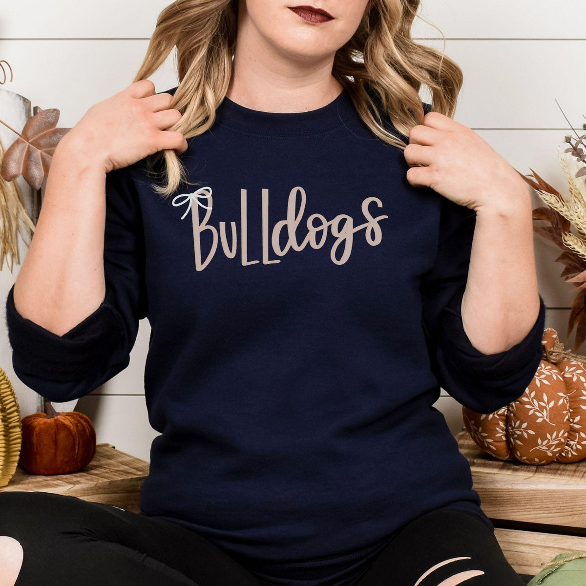 Navy Bulldogs bow embroidery sweatshirt modeled from the front