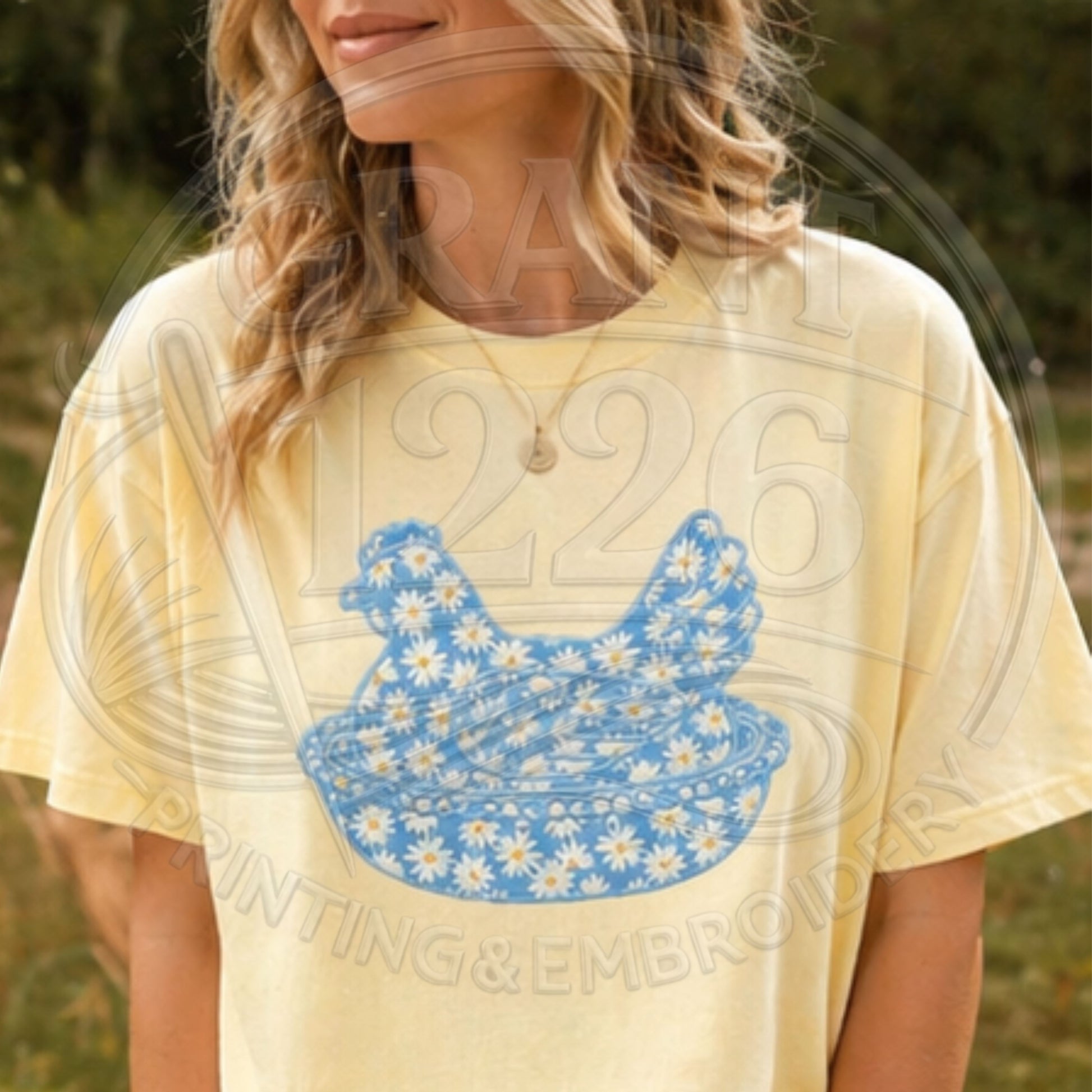 Woman wearing butter yellow floral chicken applique embroidered t-shirt