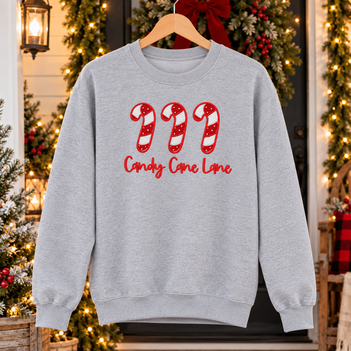 Sport Grey Candy Cane Lane embroidered sweatshirt on wood hanger