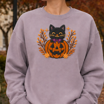Close-up of the exact black cat jack-o-lantern embroidery on a Paragon crewneck sweatshirt