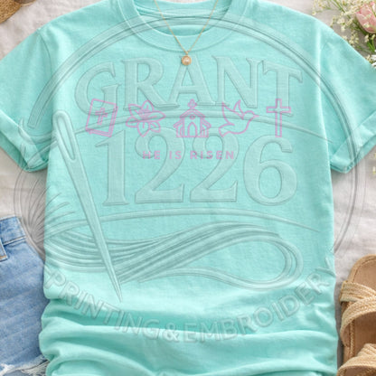 Mint green He Is Risen Christian shirt with pastel faith icons and Easter church graphic on Comfort Colors tee