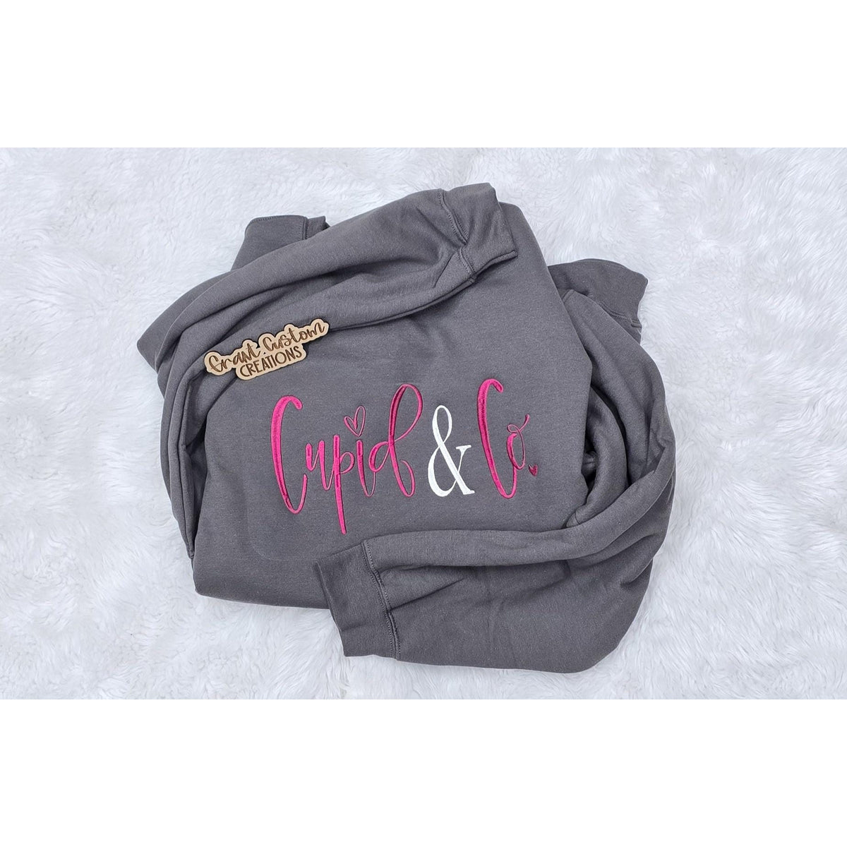 Charcoal Cupid & Co Valentine crewneck flat lay showing the embroidered full-chest design.