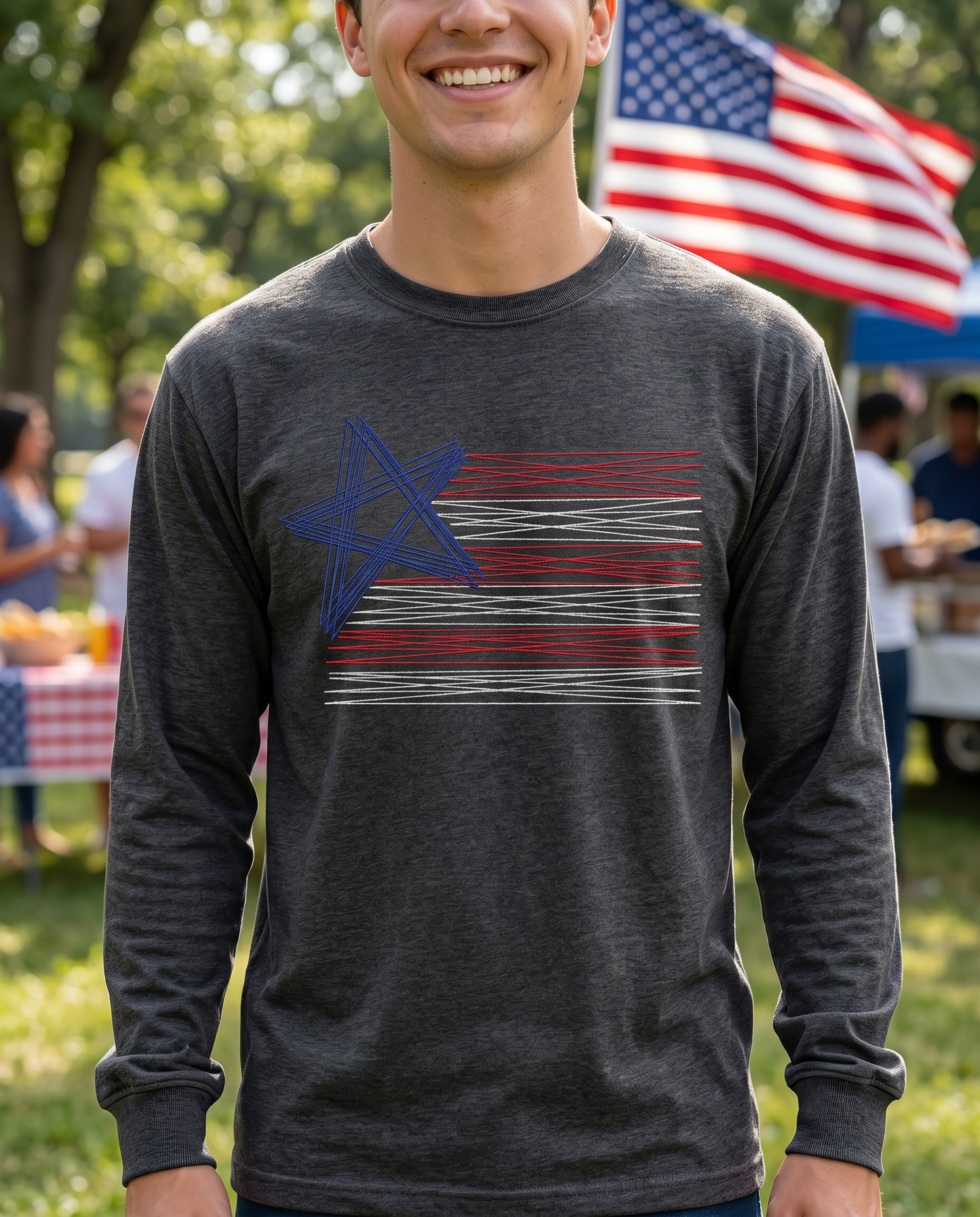 Man wearing charcoal embroidered American flag long sleeve shirt outdoors