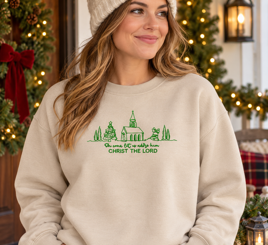 Sand Christ the Lord embroidered Christmas sweatshirt on festive porch