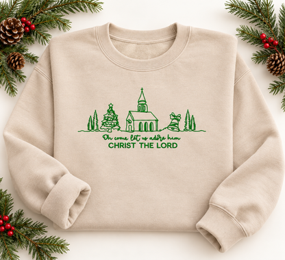 Sand Christ the Lord embroidered Christmas sweatshirt in snowy evergreen setting