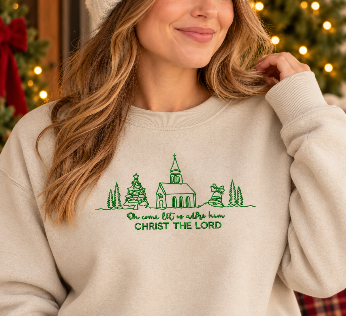 Close-up of green Christ the Lord church and trees embroidery on Sand sweatshirt