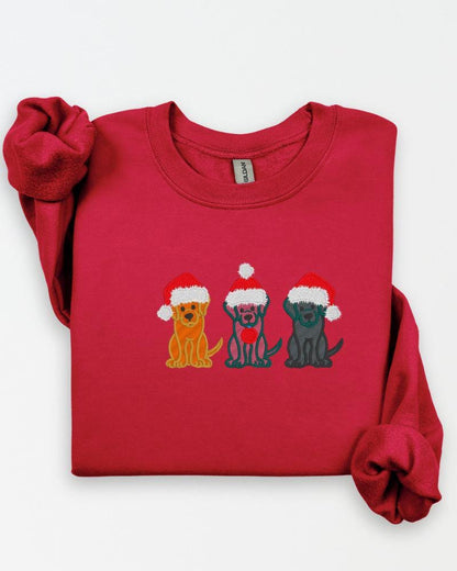 Close-up of multicolor Christmas dog embroidery stitched on a Gildan sweatshirt