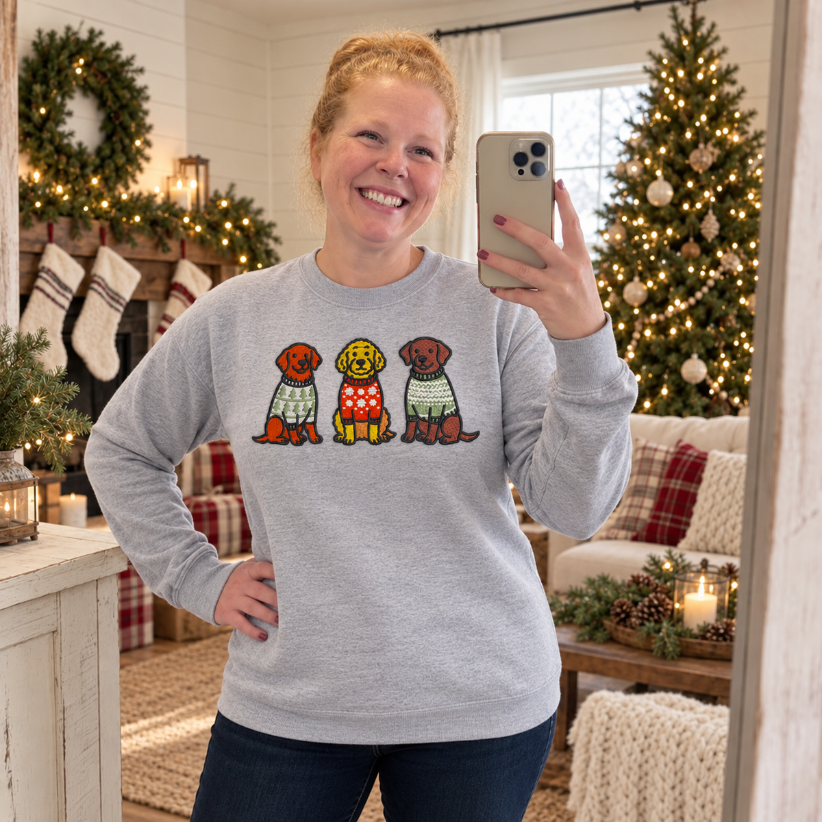 Samantha wearing a heather grey embroidered Christmas dog sweatshirt in a farmhouse holiday room