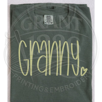 Moss green granny embroidered Comfort Colors shirt folded flat lay