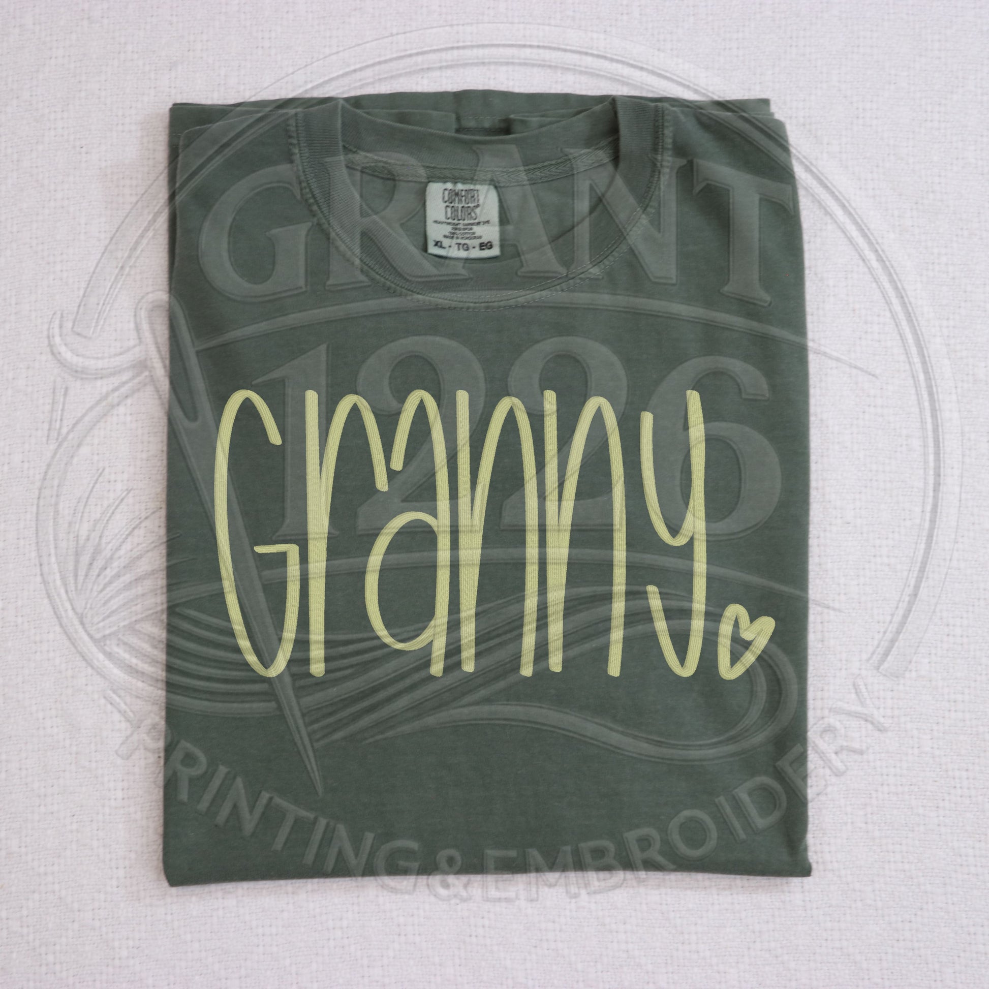 Moss granny embroidered grandma comfort colors tee folded flat lay