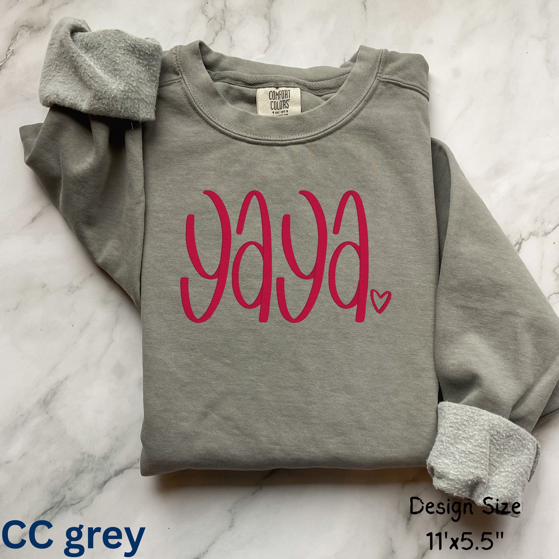 Comfort Colors gray sweatshirt with 'yaya' in pink text on a marble surface