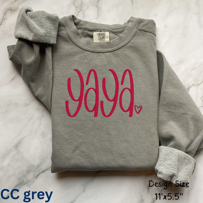 Comfort Colors gray sweatshirt with 'yaya' in pink text on a marble surface