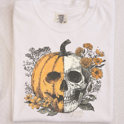 Closeup of Comfort Colors Ivory shirt with floral pumpkin skull design