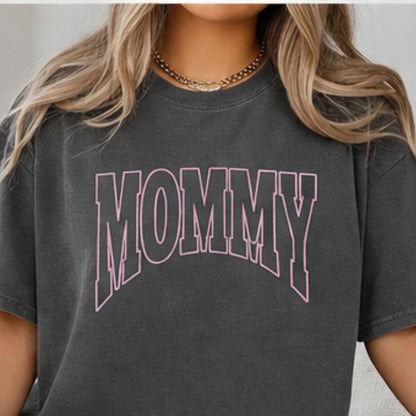 Woman wearing charcoal Comfort Colors mommy shirt with varsity puff embroidery