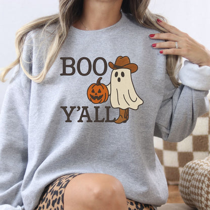 Ash Gildan sweatshirt with an embroidered cowboy ghost carrying a jack-o-lantern