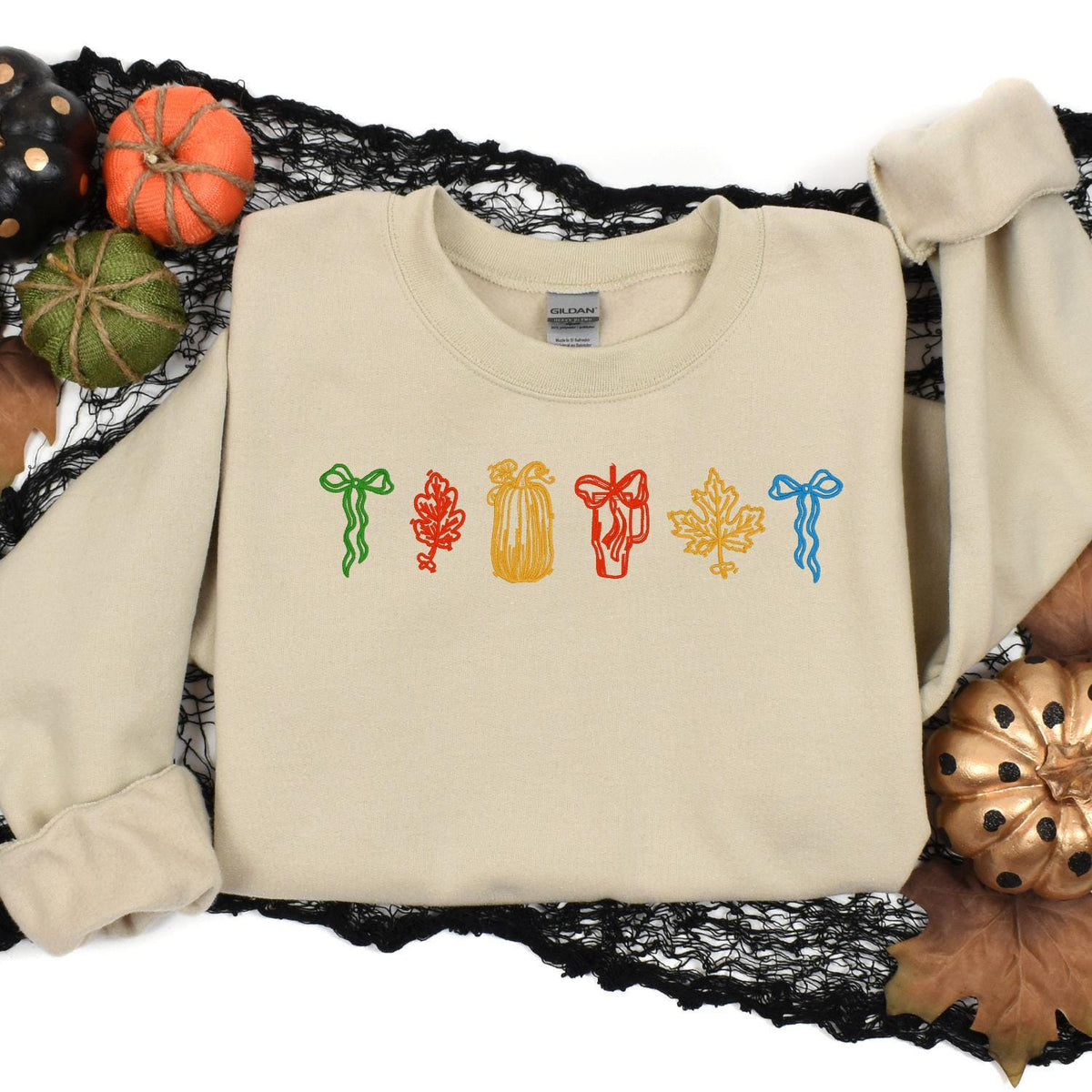 Sand fall icons sweatshirt styled with pumpkins and black lace