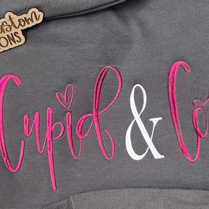 Close view of the pink and white Cupid & Co machine embroidery stitch detail.