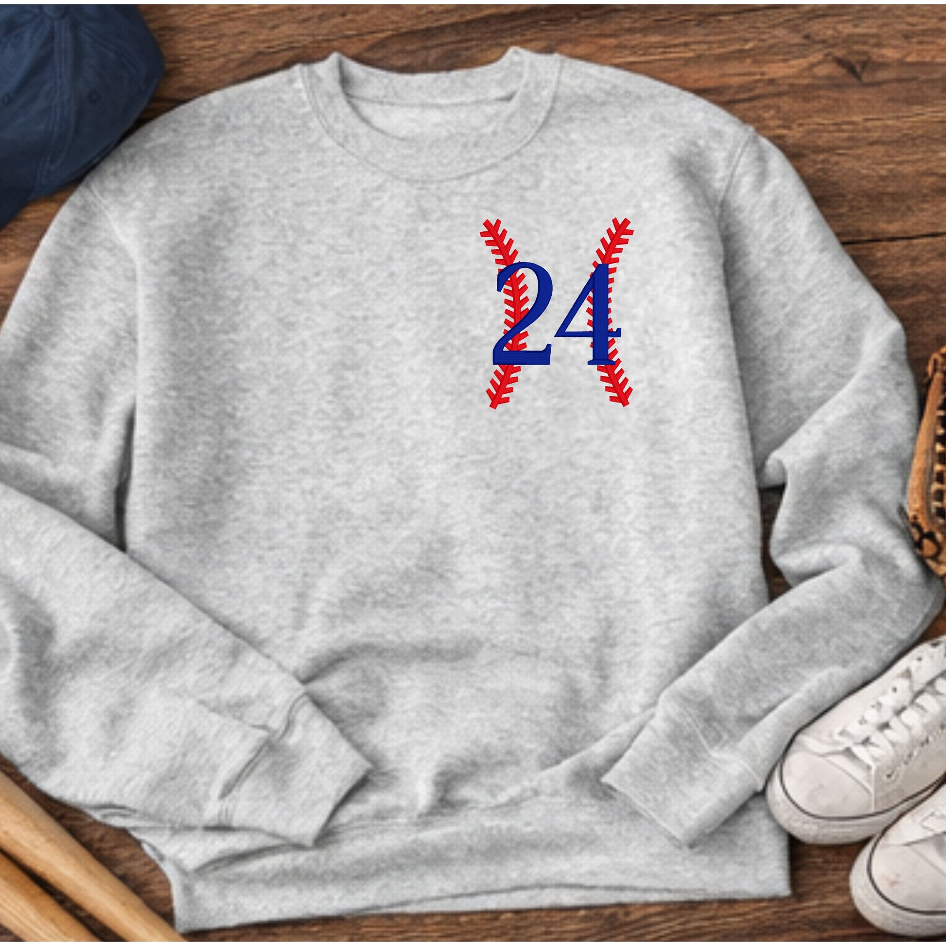 Detailed embroidery of custom baseball number with red baseball stitching design