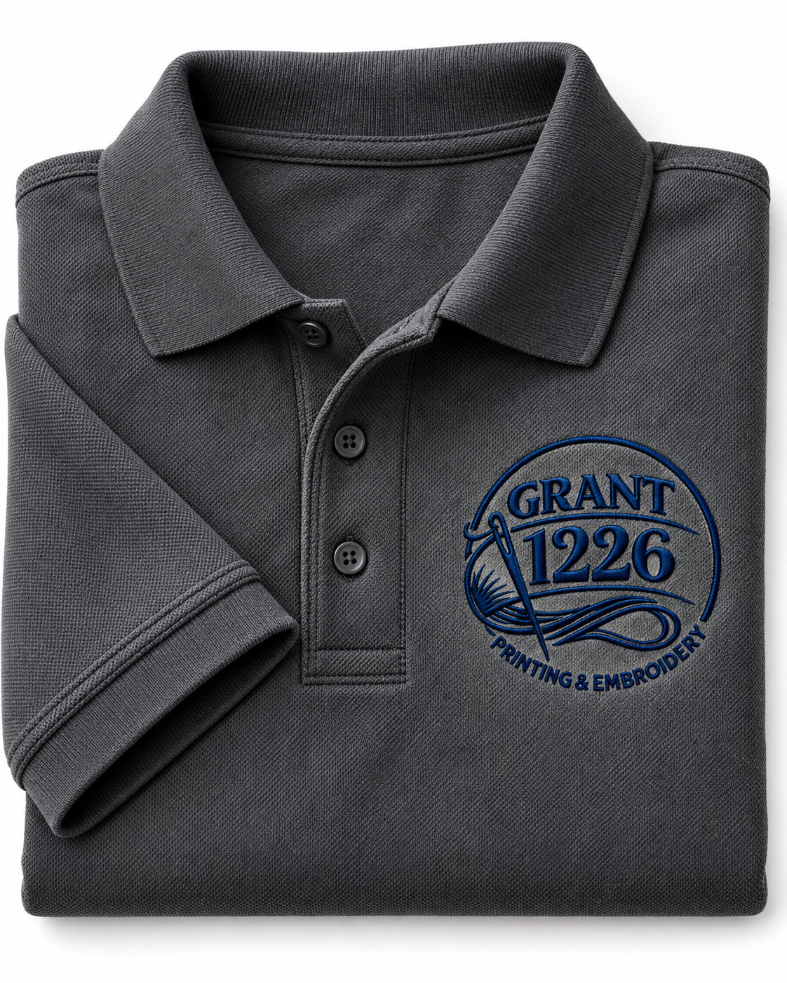 Charcoal Port Authority K100 work polo folded to show Grant 1226 left-chest embroidery