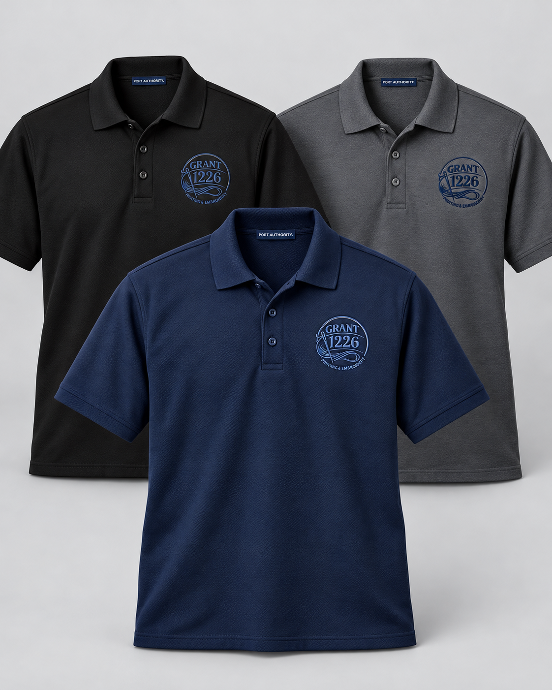 Black navy and charcoal Port Authority K100 work polos with Grant 1226 left-chest embroidery