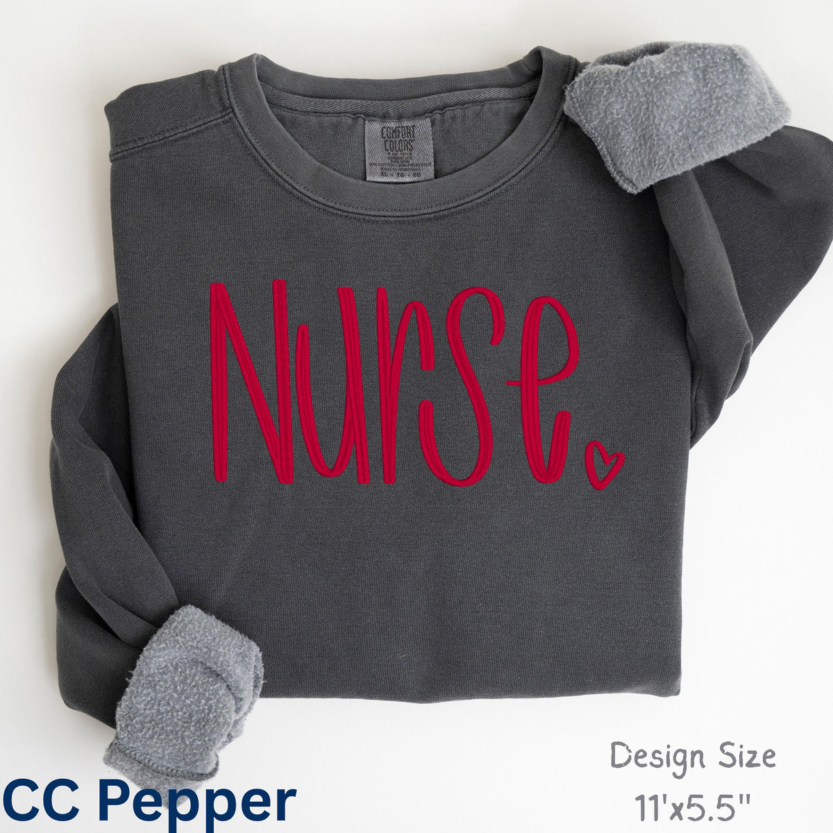 Folded pepper Comfort Colors sweatshirt with custom Nurse script embroidery