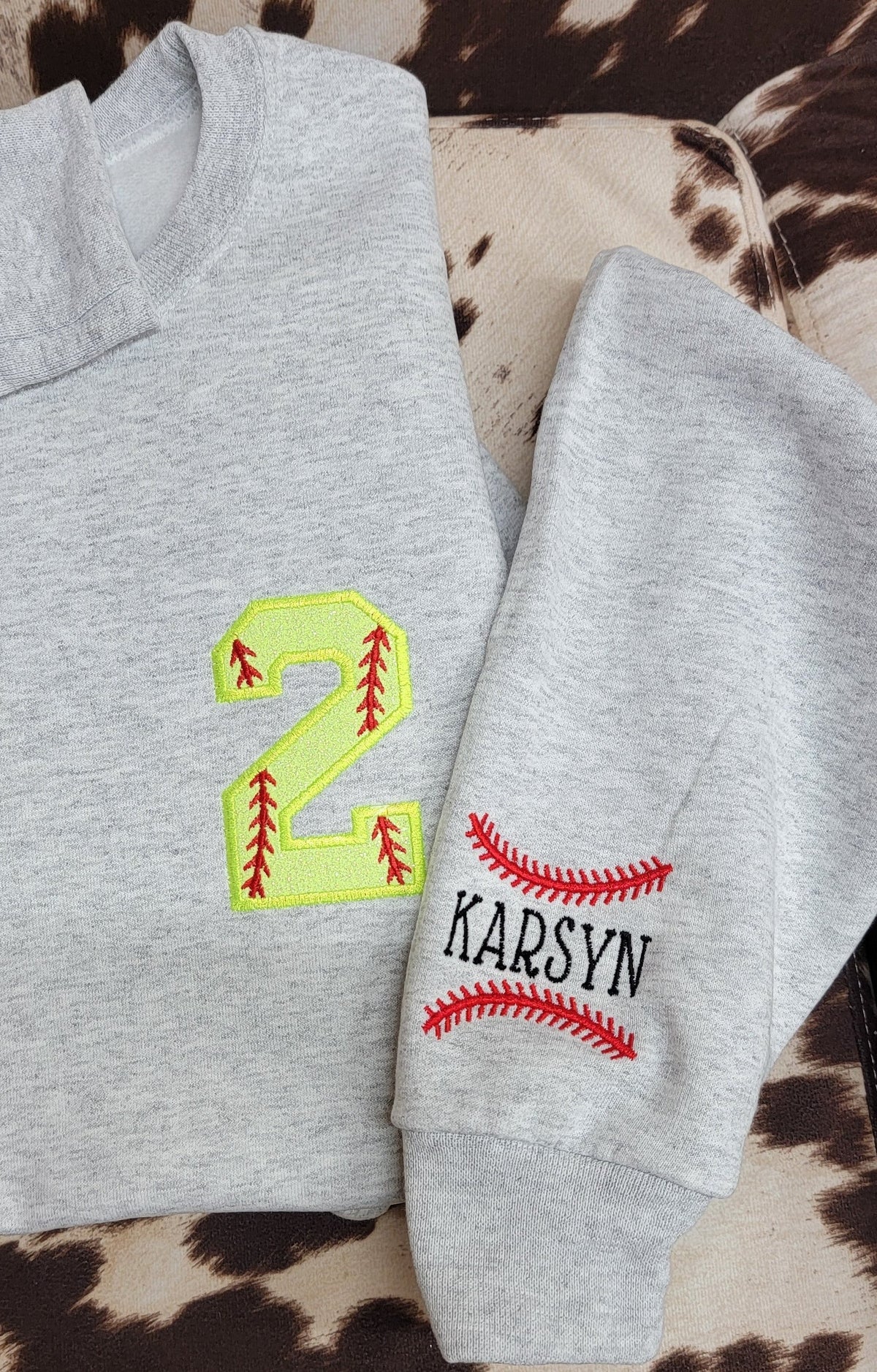 Custom player number sweatshirt with optional name personalized on the sleeve