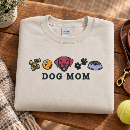 Folded Sand Dog Mom embroidered sweatshirt with leash and tennis ball