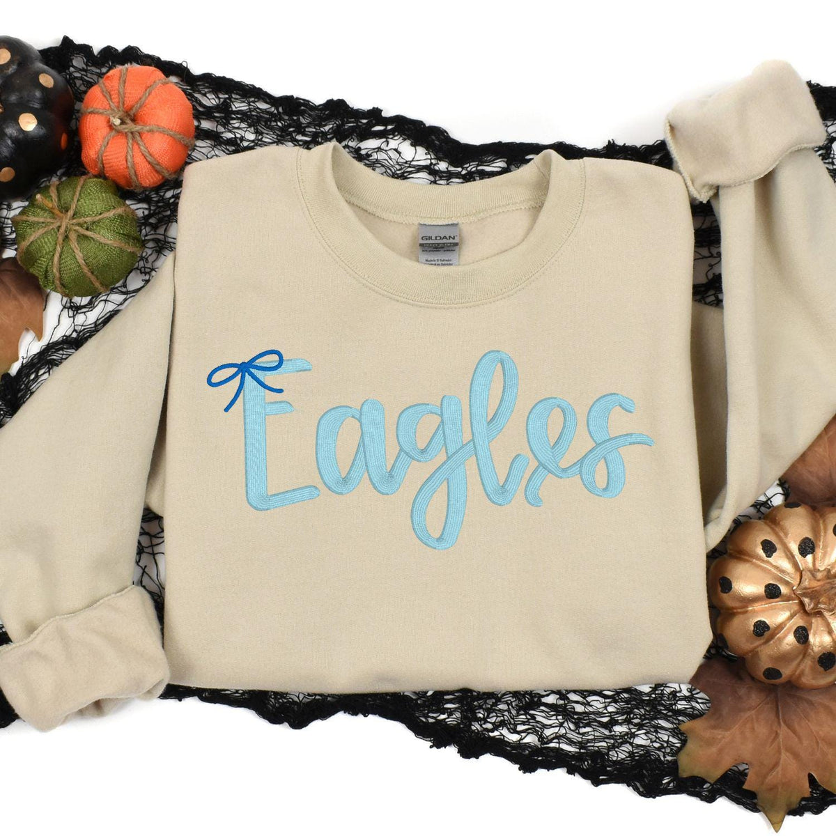 Sport gray Eagles script sweatshirt modeled with leopard-print pants