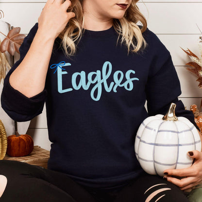 Navy sweatshirt with light blue Eagles script embroidery modeled from the front
