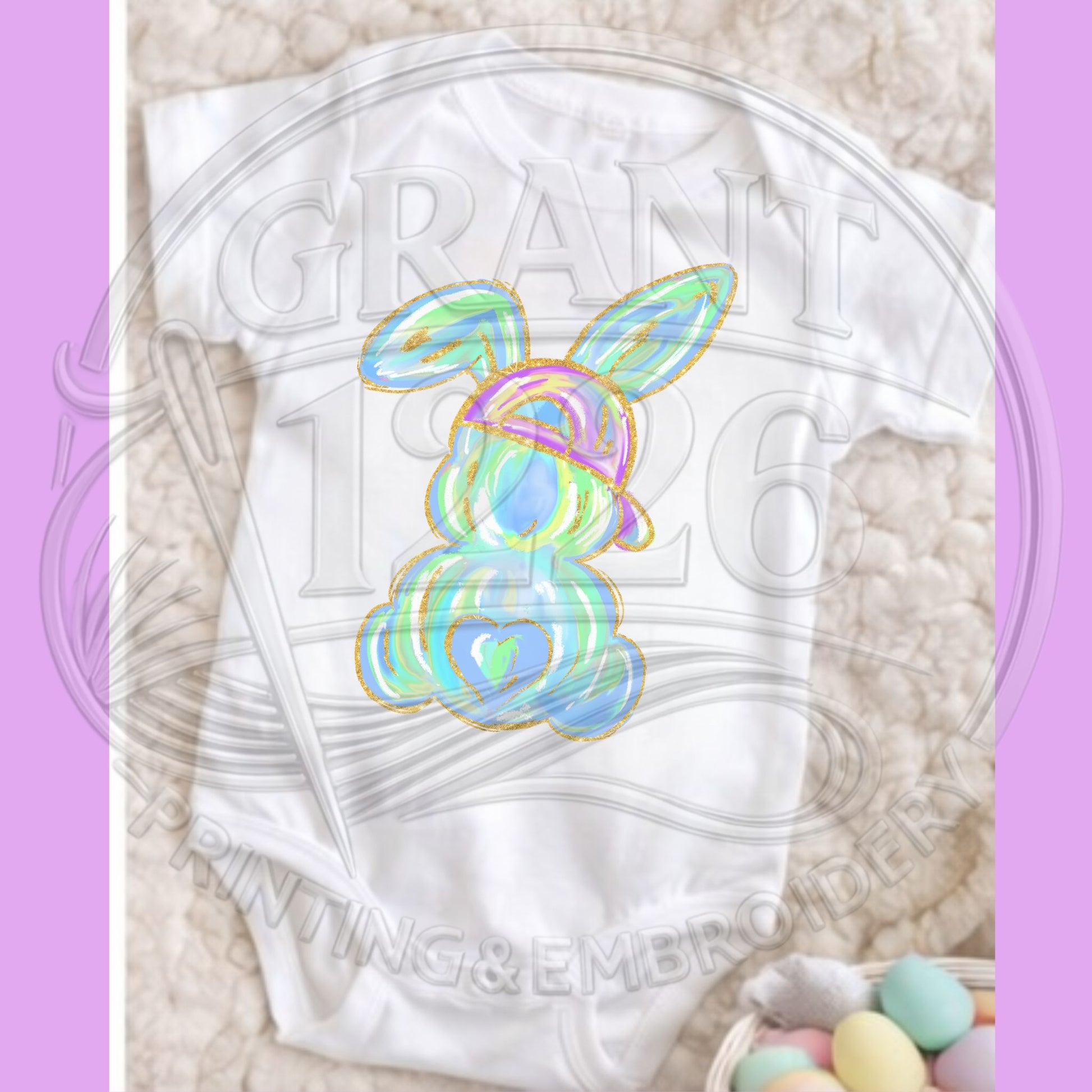 Close up of pastel Easter bunny shirt artwork with gold outline