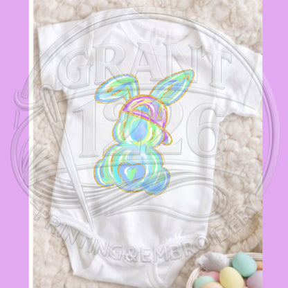 Close up of pastel Easter bunny shirt artwork with gold outline