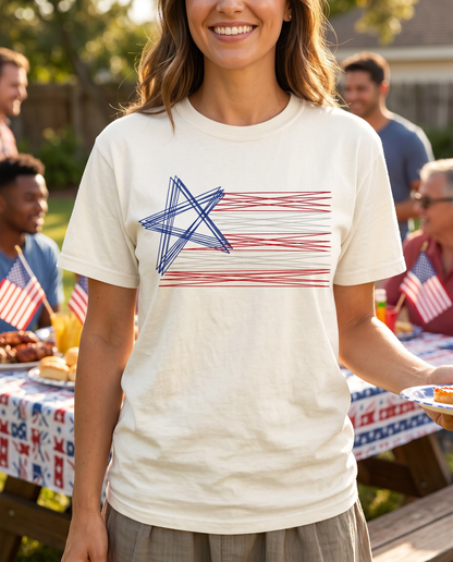 Woman wearing cream embroidered American flag shirt at patriotic backyard barbecue