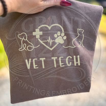 Folded embroidered vet tech gift shirt with dog and cat design
