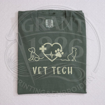 Green Comfort Colors embroidered vet tech shirt flat lay