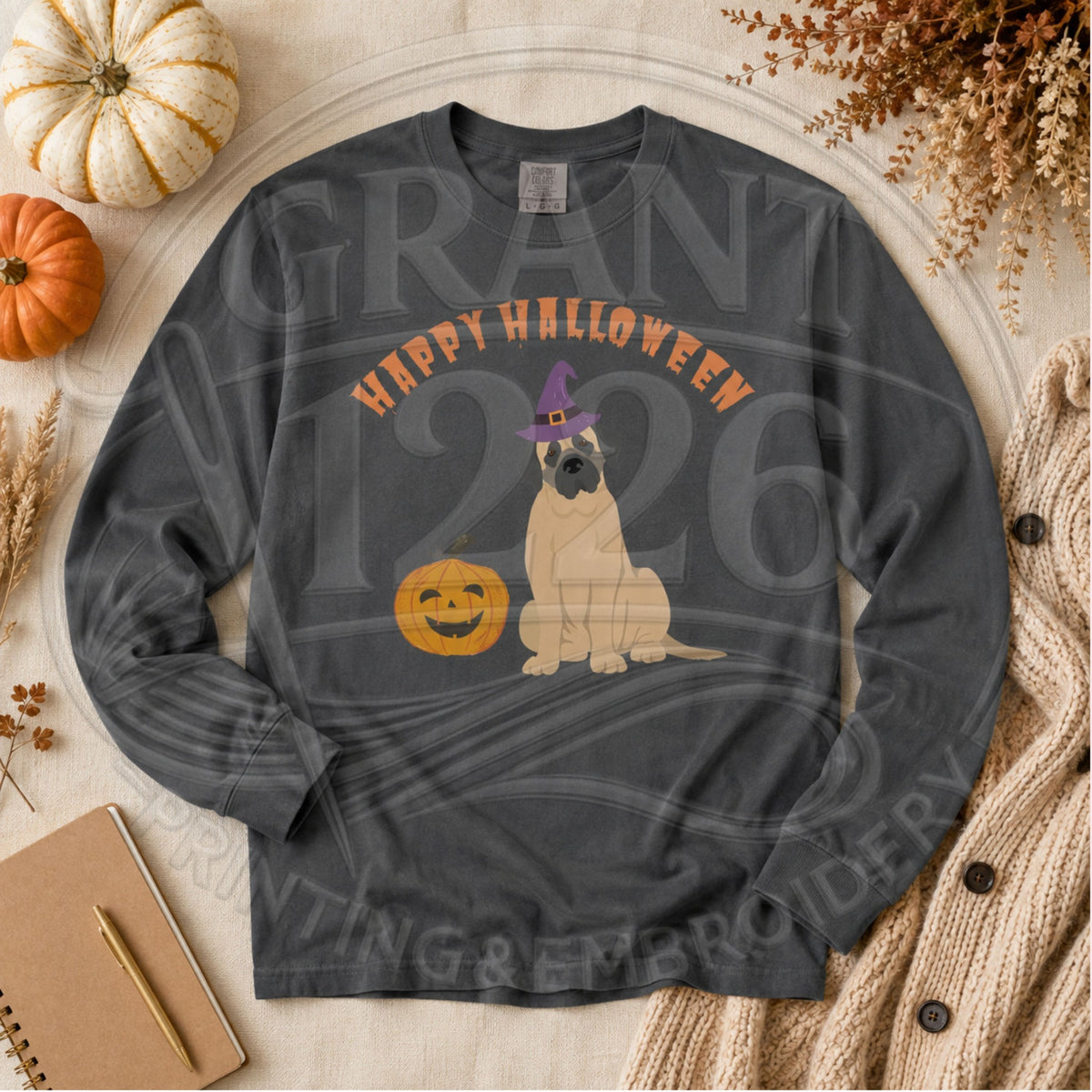 Pepper Comfort Colors long sleeve English Mastiff Halloween shirt flat lay with witch hat dog and pumpkin