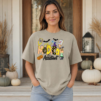 Sandstone Comfort Colors Medical Assistant Halloween shirt shown in a fall porch setting with pumpkins.