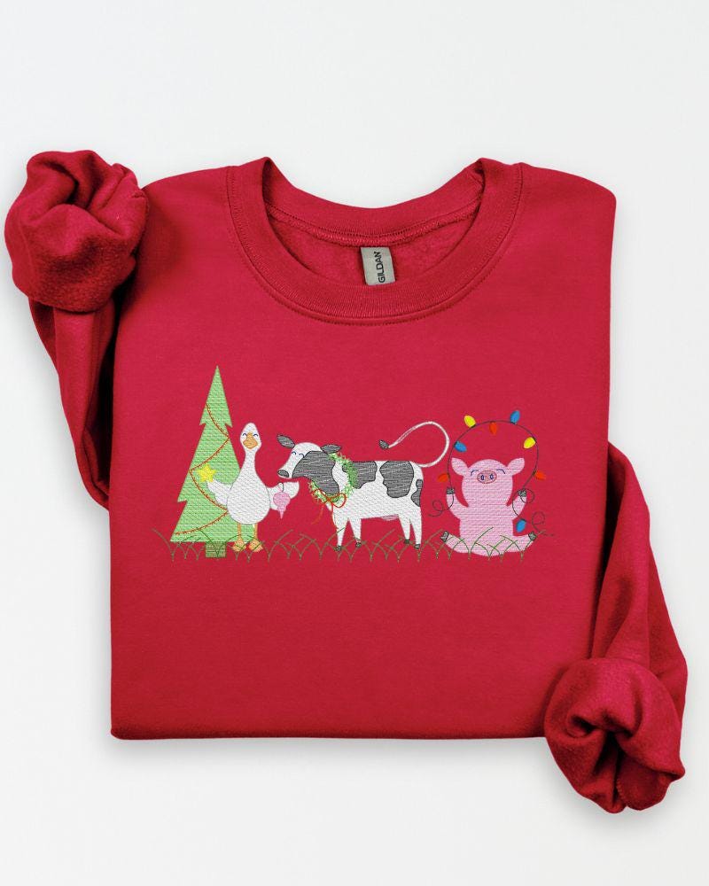 Farm animal Christmas embroidery on a cozy Gildan crewneck sweatshirt.