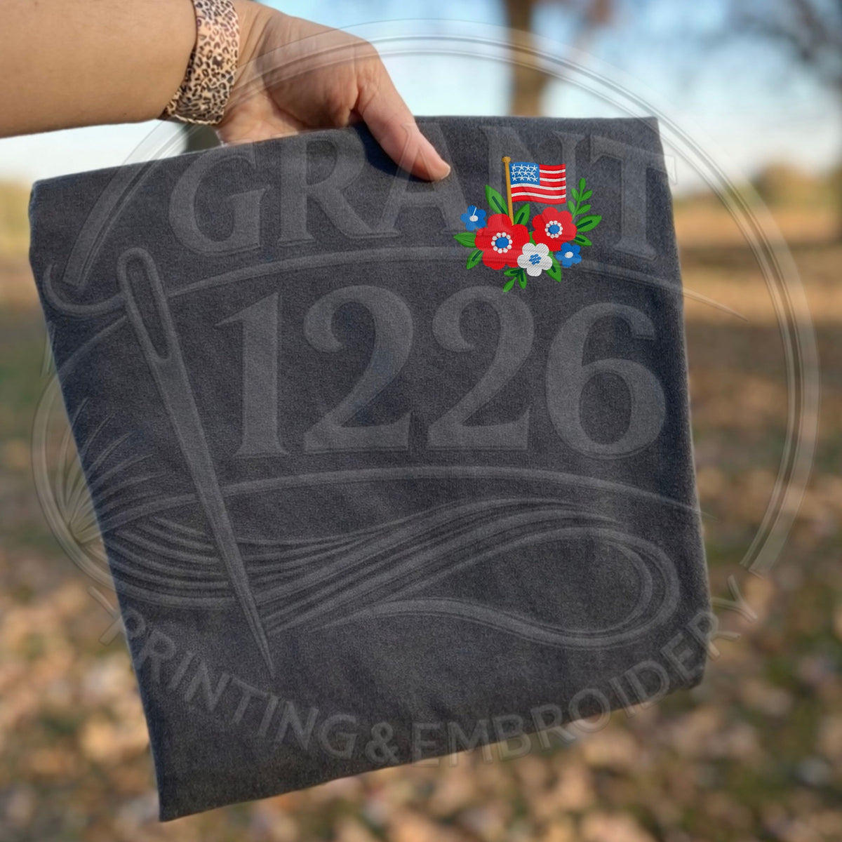 Charcoal T-shirt with floral American flag embroidery on left chest